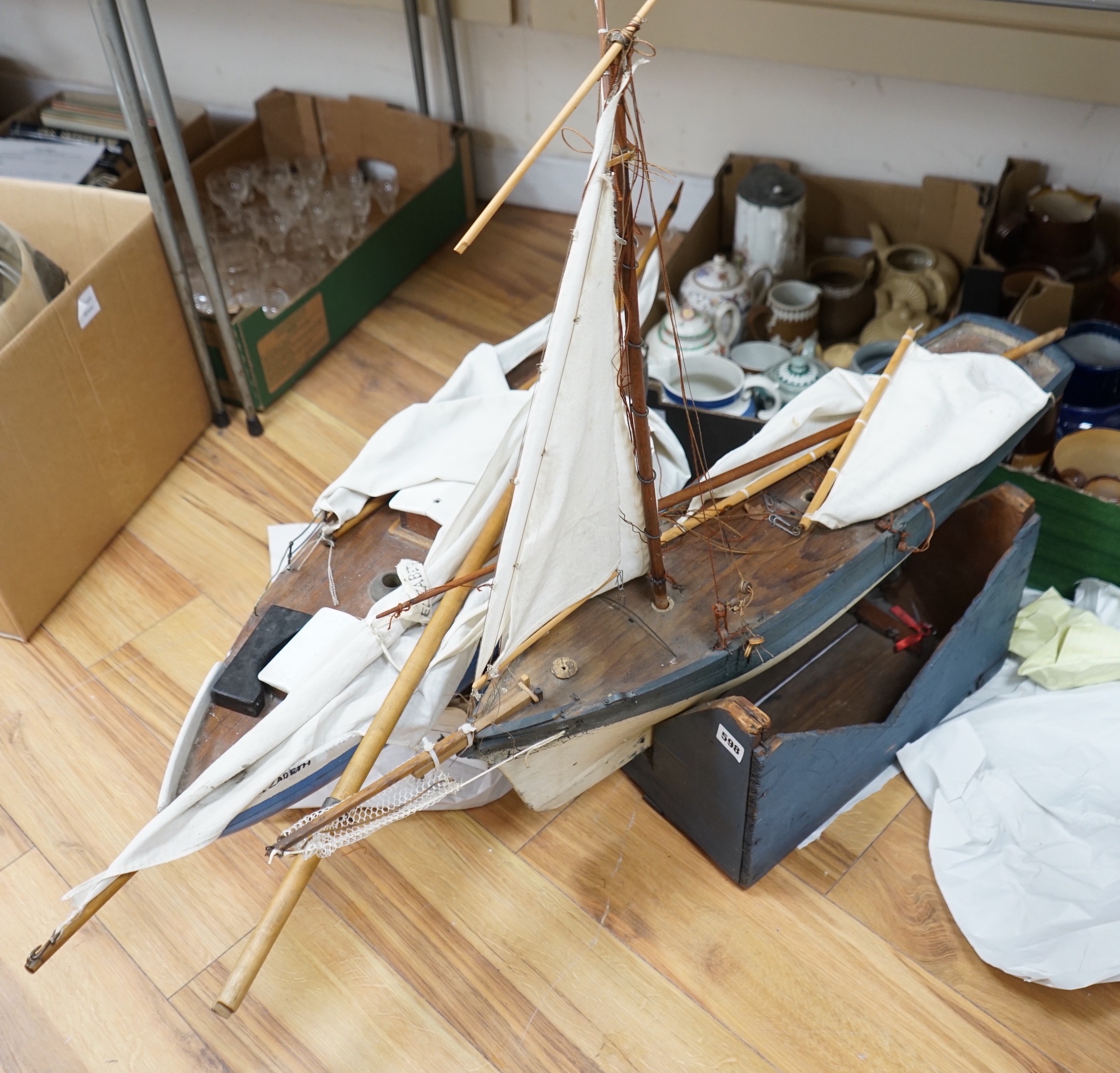 Two large over-painted pond yachts, largest 91cms